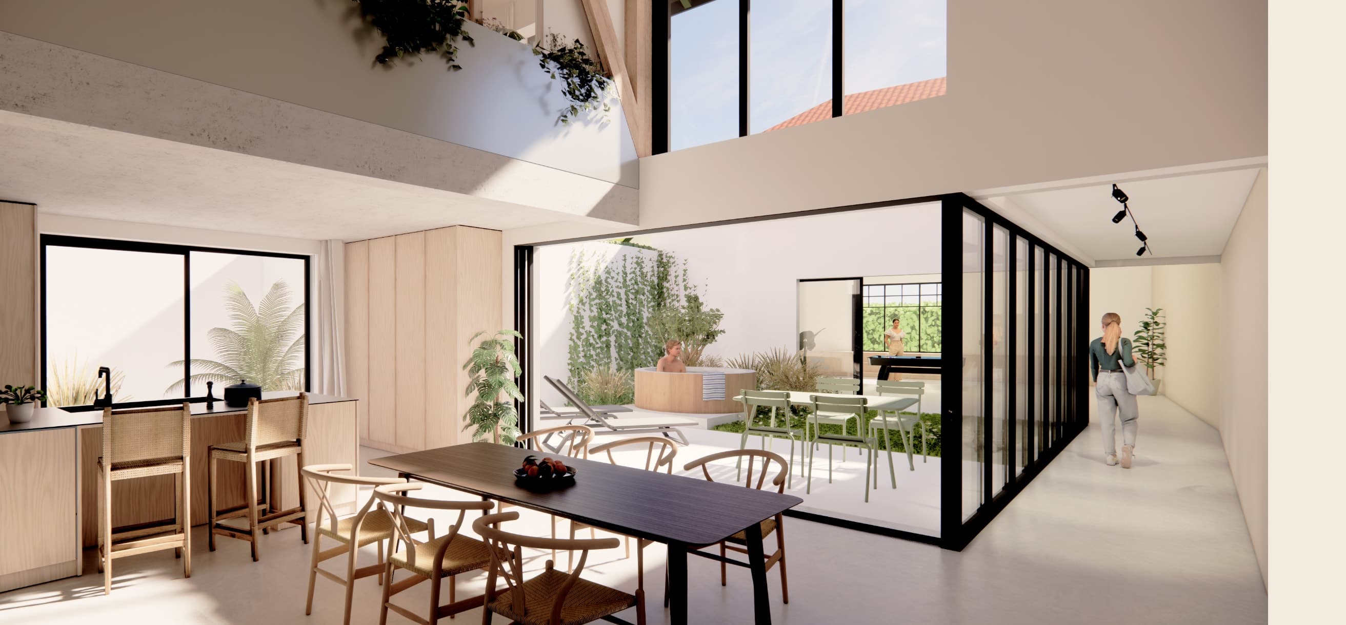 Loft N°03 — cuisine et salle à manger ouvrant sur deux patios végétalisés.